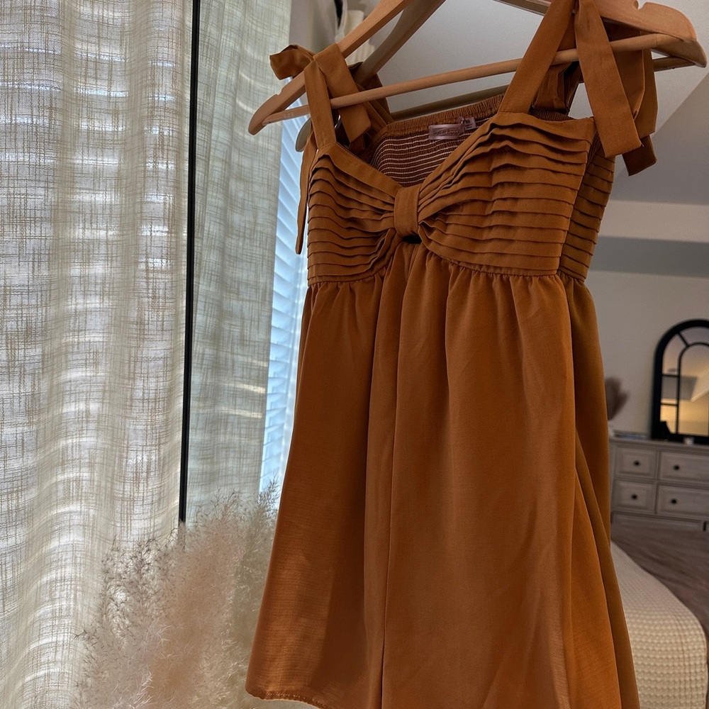 Bronze romper in a beautiful cut. So flattering. Never worn!